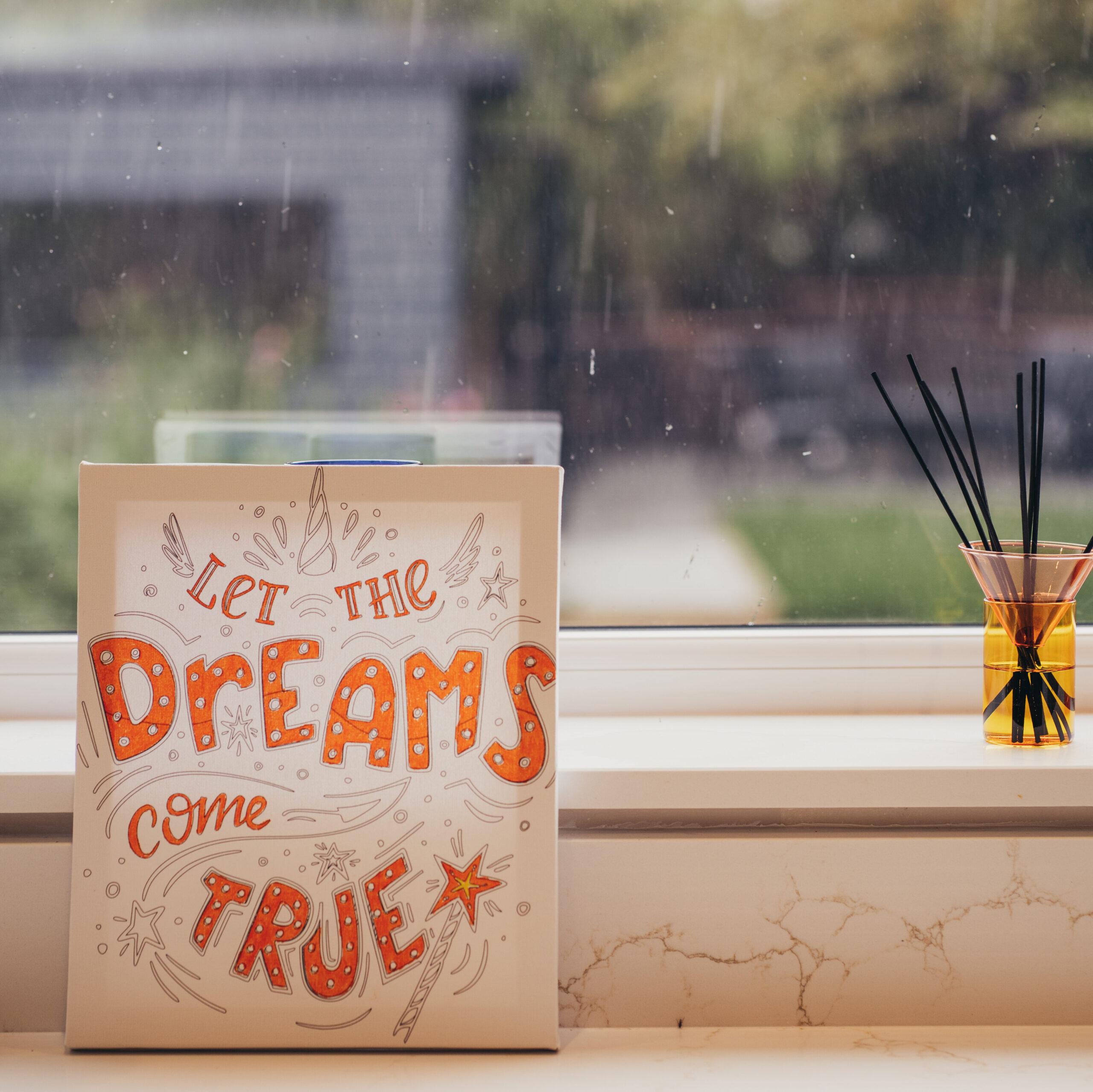 Let the Dreams Come True card displayed against a windowsill in a NeoKit kitchen